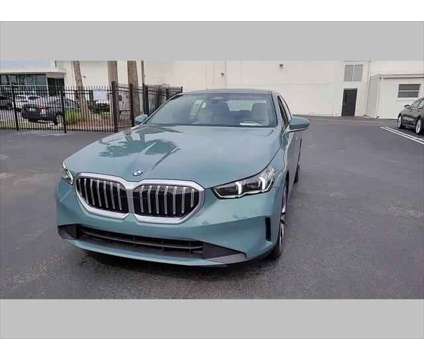 2024 BMW 5 Series i is a Green 2024 BMW 5-Series Sedan in Jacksonville FL