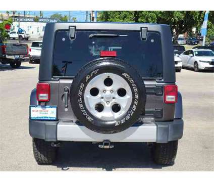 2014 Jeep Wrangler Unlimited Sahara is a Grey 2014 Jeep Wrangler Unlimited Sahara SUV in San Antonio TX