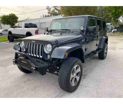 2017 Jeep Wrangler Unlimited for sale is a Grey 2017 Jeep Wrangler Unlimited Car for Sale in Hallandale Beach FL