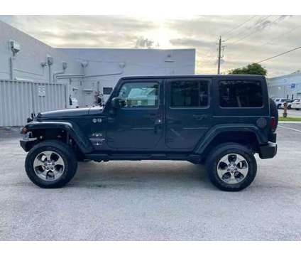 2017 Jeep Wrangler Unlimited for sale is a Grey 2017 Jeep Wrangler Unlimited Car for Sale in Hallandale Beach FL