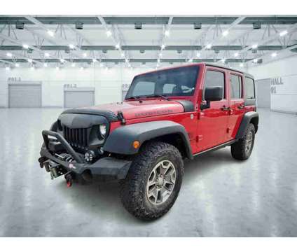 2014UsedJeepUsedWrangler UnlimitedUsed4WD 4dr is a Red 2014 Jeep Wrangler Unlimited Rubicon Car for Sale in Pampa TX