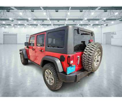 2014UsedJeepUsedWrangler UnlimitedUsed4WD 4dr is a Red 2014 Jeep Wrangler Unlimited Rubicon Car for Sale in Pampa TX