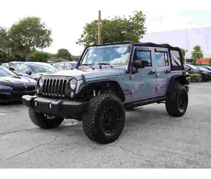 2016 Jeep Wrangler Unlimited Sport is a Silver 2016 Jeep Wrangler Unlimited SUV in Miami FL