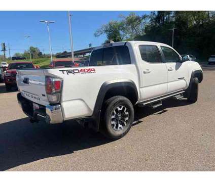 2021 Toyota Tacoma TRD Off-Road V6 is a White 2021 Toyota Tacoma TRD Off Road Truck in Vicksburg MS