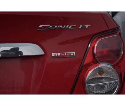 2015 Chevrolet Sonic LT Auto is a Red 2015 Chevrolet Sonic LT Sedan in Lindon UT