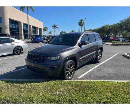 2016 Jeep Grand Cherokee Limited is a Grey 2016 Jeep grand cherokee Limited Car for Sale in Orlando FL