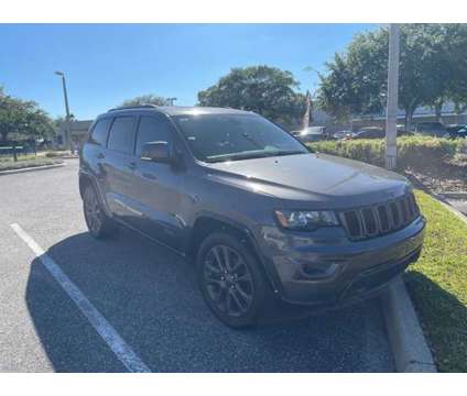 2016 Jeep Grand Cherokee Limited is a Grey 2016 Jeep grand cherokee Limited Car for Sale in Orlando FL
