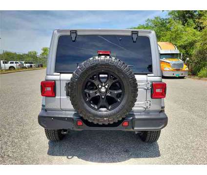 2019 Jeep Wrangler Unlimited Moab is a Silver 2019 Jeep Wrangler Unlimited Car for Sale in Orlando FL