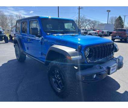 2024 Jeep Wrangler Willys Wheeler is a Blue 2024 Jeep Wrangler SUV in Freeport IL
