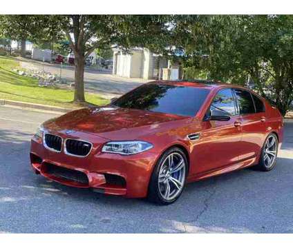 2016 BMW M5 for sale is a Orange 2016 BMW M5 Car for Sale in Frederick MD