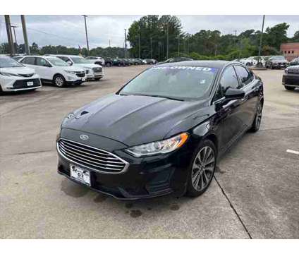 2019 Ford Fusion SE is a Black 2019 Ford Fusion SE Sedan in Texarkana TX