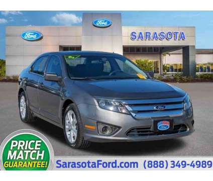 2012 Ford Fusion SE is a Grey 2012 Ford Fusion SE Car for Sale in Sarasota FL