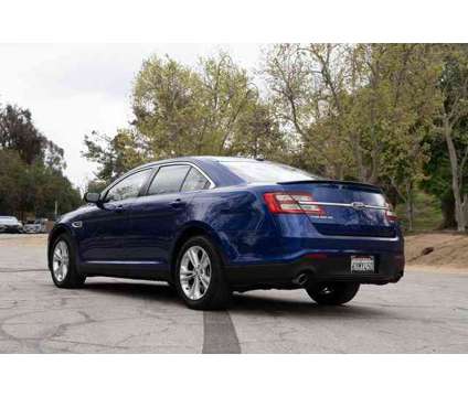 2013 Ford Taurus SEL is a Blue 2013 Ford Taurus SEL Sedan in Riverside CA