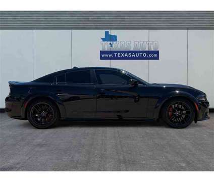 2022 Dodge Charger R/T Scat Pack Widebody is a Black 2022 Dodge Charger R/T Scat Pack Sedan in Houston TX