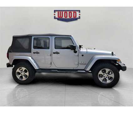 2017 Jeep Wrangler Unlimited Sahara is a Silver 2017 Jeep Wrangler Unlimited Sahara SUV in Harrison AR