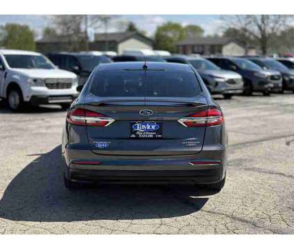 2020 Ford Fusion Energi Titanium is a Silver 2020 Ford Fusion Energi Titanium Sedan in Manteno IL