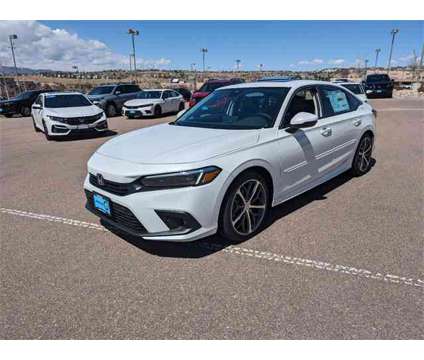 2024 Honda Civic Touring is a Silver, White 2024 Honda Civic Touring Sedan in Colorado Springs CO