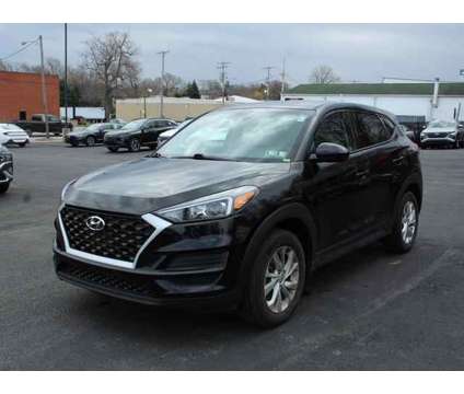 2021 Hyundai Tucson SE is a Black 2021 Hyundai Tucson SE SUV in Erie PA