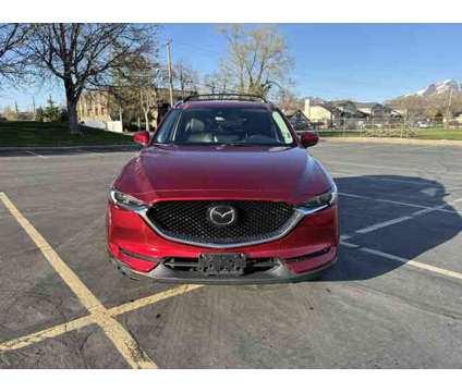 2021 Mazda CX-5 Grand Touring AWD is a Red 2021 Mazda CX-5 Grand Touring SUV in Salt Lake City UT