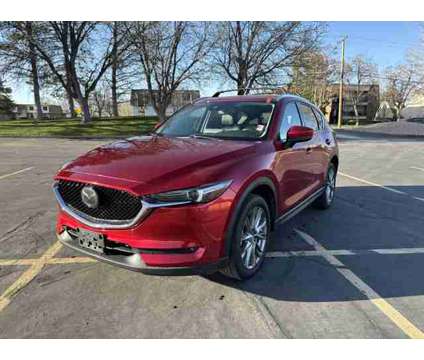 2021 Mazda CX-5 Grand Touring AWD is a Red 2021 Mazda CX-5 Grand Touring SUV in Salt Lake City UT