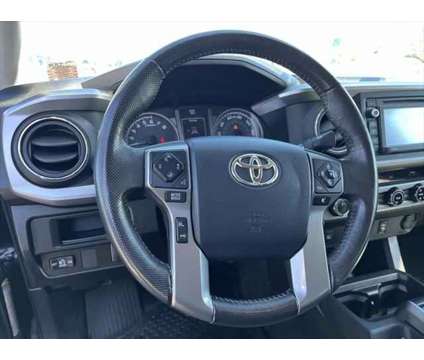 2017 Toyota Tacoma SR5 V6 is a Black 2017 Toyota Tacoma SR5 Truck in Utica NY