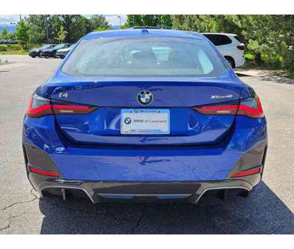 2024 BMW i4 xDrive40 is a Blue 2024 Sedan in Loveland CO