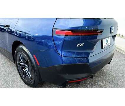 2024 BMW iX xDrive50 is a Blue 2024 BMW 325 Model iX SUV in Bay Shore NY