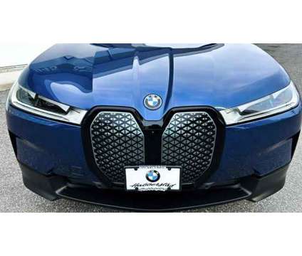 2024 BMW iX xDrive50 is a Blue 2024 BMW 325 Model iX SUV in Bay Shore NY