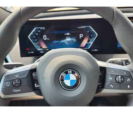 2025 BMW iX xDrive50 is a Blue 2025 BMW 325 Model iX SUV in Loveland CO