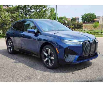 2025 BMW iX xDrive50 is a Blue 2025 BMW 325 Model iX SUV in Loveland CO