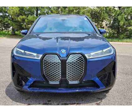 2025 BMW iX xDrive50 is a Blue 2025 BMW 325 Model iX SUV in Loveland CO