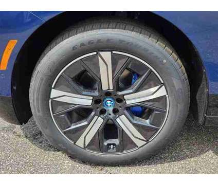 2025 BMW iX xDrive50 is a Blue 2025 BMW 325 Model iX SUV in Loveland CO