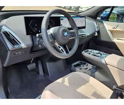 2025 BMW iX xDrive50 is a Blue 2025 BMW 325 Model iX SUV in Loveland CO