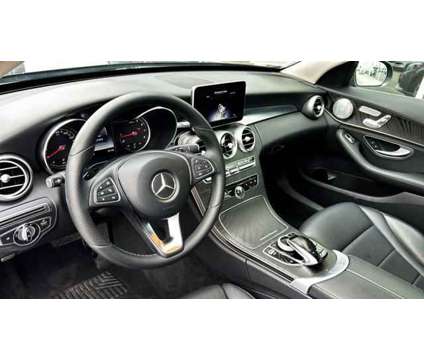 2015 Mercedes-Benz C-Class Sport 4MATIC is a Grey 2015 Mercedes-Benz C Class Sedan in Bay Shore NY