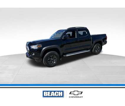 2021 Toyota Tacoma SR5 V6 is a Black 2021 Toyota Tacoma SR5 Truck in Little River SC