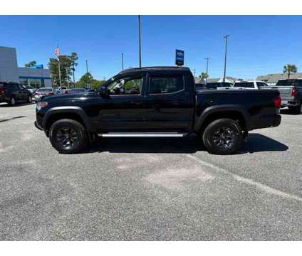 2021 Toyota Tacoma SR5 V6 is a Black 2021 Toyota Tacoma SR5 Truck in Little River SC