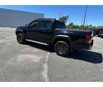 2021 Toyota Tacoma SR5 V6 is a Black 2021 Toyota Tacoma SR5 Truck in Little River SC