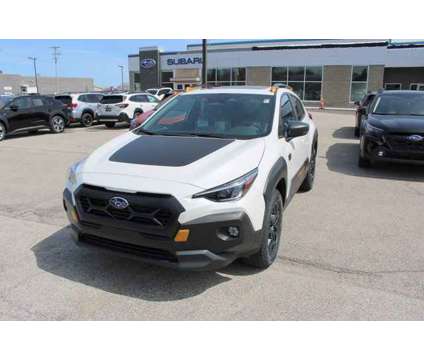 2024 Subaru Crosstrek Wilderness is a White 2024 Subaru Crosstrek 2.0i SUV in Bay City MI