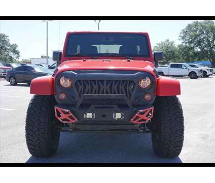 2015 Jeep Wrangler Unlimited Sahara is a Red 2015 Jeep Wrangler Unlimited Sahara SUV in Tampa FL
