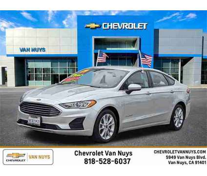 2019 Ford Fusion Hybrid SE is a Silver 2019 Ford Fusion Hybrid SE Hybrid in Van Nuys CA