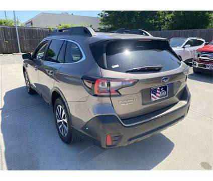 2021 Subaru Outback Premium is a Tan 2021 Subaru Outback 2.5i SUV in Dallas TX