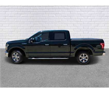 2015 Ford F-150 XLT is a Green 2015 Ford F-150 XLT Car for Sale in Collins MS