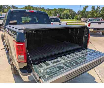 2015 Ford F-150 XLT is a Green 2015 Ford F-150 XLT Car for Sale in Collins MS