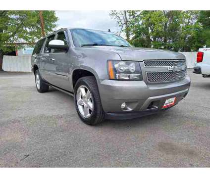 2012 Chevrolet Suburban 1500 for sale is a Grey 2012 Chevrolet Suburban 1500 Trim Car for Sale in Conroe TX