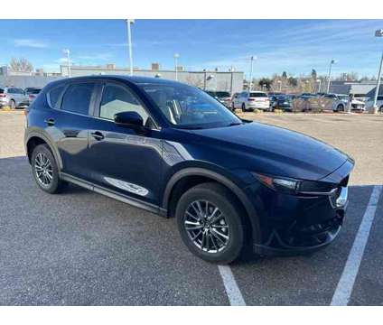 2021 Mazda CX-5 Touring is a Blue 2021 Mazda CX-5 Touring SUV in Littleton CO
