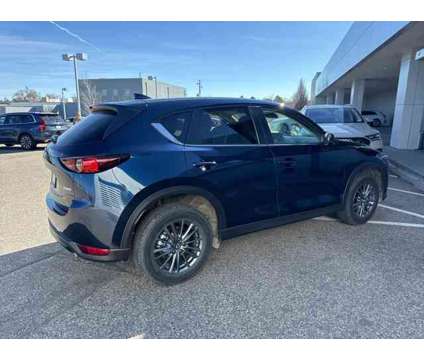 2021 Mazda CX-5 Touring is a Blue 2021 Mazda CX-5 Touring SUV in Littleton CO