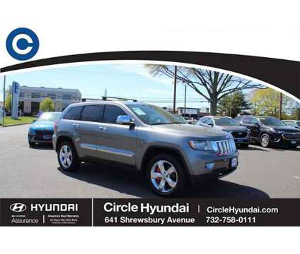 2013 Jeep Grand Cherokee Overland Summit is a Grey 2013 Jeep grand cherokee Overland SUV in Shrewsbury NJ
