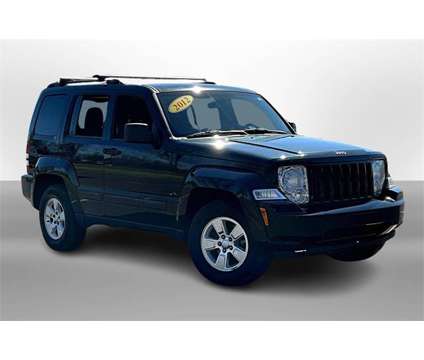 2012 Jeep Liberty Sport is a Black, Green 2012 Jeep Liberty Sport Car for Sale in Durand MI