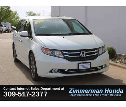 2014 Honda Odyssey Touring Elite is a White 2014 Honda Odyssey Touring Car for Sale in Moline IL