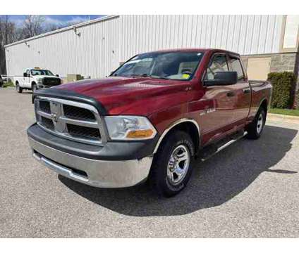 2010 Dodge Ram 1500 ST is a Red 2010 Dodge Ram 1500 ST Car for Sale in Traverse City MI